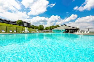 Outdoor swimming pool and lounge chairs at Canaan Valley Resort