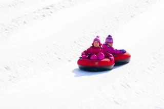 Guests riding snow tubes at Canaan Valley Resort