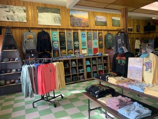 Local apparel and outdoor clothing displayed inside The Davis Depot