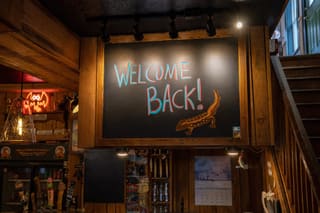 Welcome Back chalkboard inside Hellbender Burritos