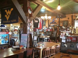 Rustic dining room and counter inside Sirianni's Pizza Cafe