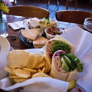 Sandwiches, chips, and side dishes served at The Purple Fiddle