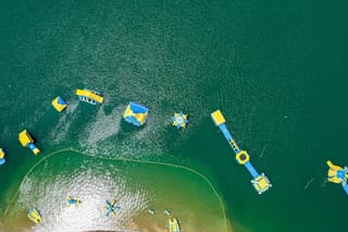 Aerial view of the inflatable obstacle course at Tygart Adventure Lake