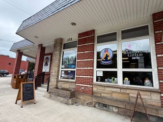 Storefront of The Adventure Guild Game Shop at 172 East Avenue in Thomas