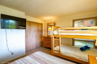 Downstairs twin bunk room with full bed