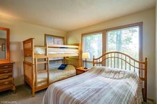 Downstairs twin bunk room with full bed