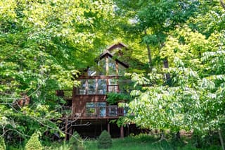 Back of Trail Magic Chalet from yard below in summer