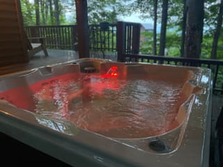 Running hot tub on the covered lower deck in summer