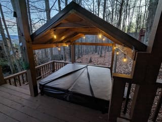 Covered hot tub on the lower deck with an open view across Canaan Valley