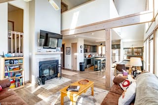 Living room with winter theme and renovated kitchen