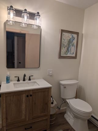 Completely renovated downstairs master bath featuring a new vanity and ADA height toilet
