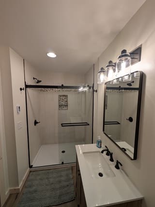 Completely renovated downstairs master bath with large walk-in shower and sliding glass doors