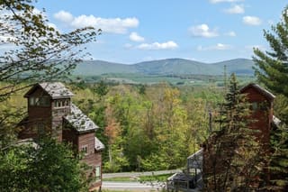 View from deck of Trail Magic Chalet onto Timberline Mountain in summer