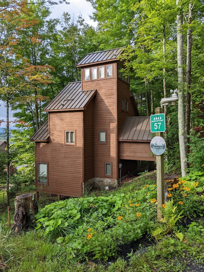 Trail Magic Chalet side view in summer